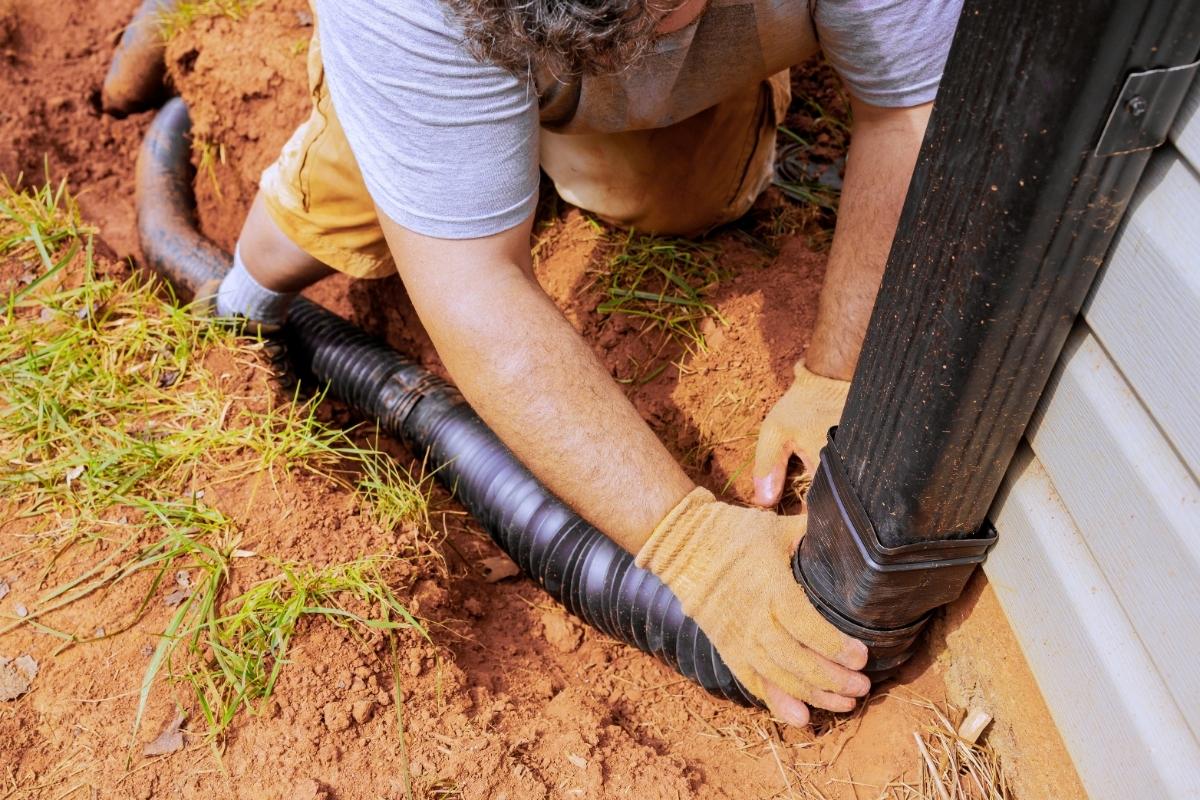 Downspout Underground Installation: Costs & Compliance Tips